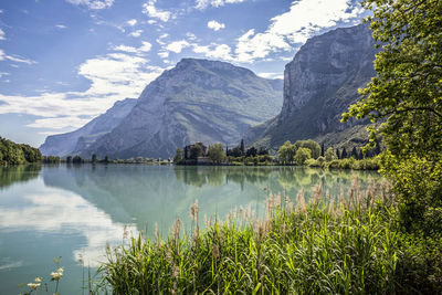 Scenic view of lake and mountains against sky