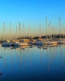 Boats moored at harbor