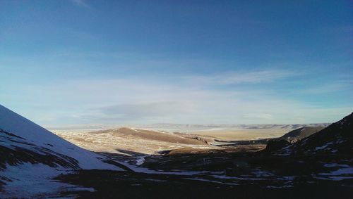 Scenic view of snow covered mountains