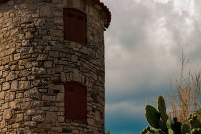 Low angle view of old building against sky