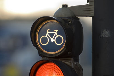 Close-up of illuminated sign on road