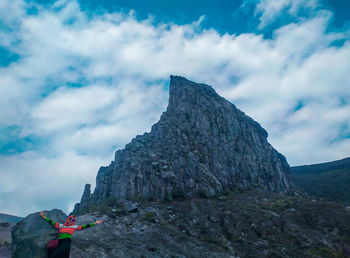 Low angle view of rock formation against sky