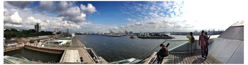 View of harbor against cloudy sky