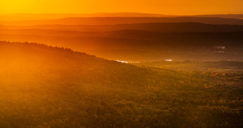 Scenic view of landscape against sky during sunset