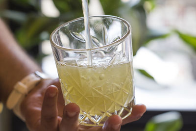 Close-up of hand holding drink