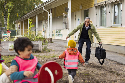 Father collecting child from school