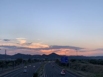 High angle view of highway against sky during sunset