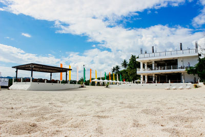 View of beach against cloudy sky