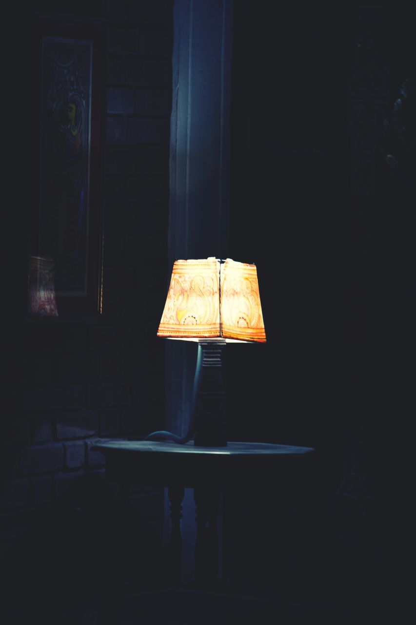 indoors, illuminated, dark, home interior, night, still life, wall - building feature, lighting equipment, table, copy space, burning, old, no people, close-up, darkroom, room, wood - material, house, flame, electric lamp