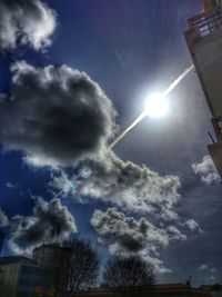 Low angle view of building against cloudy sky