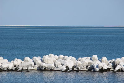 Scenic view of sea against blue sky