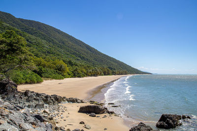 Scenic view of sea against clear blue sky