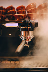 Close-up of steam emitting from espresso maker