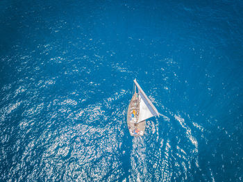 High angle view of sailboat sailing in sea