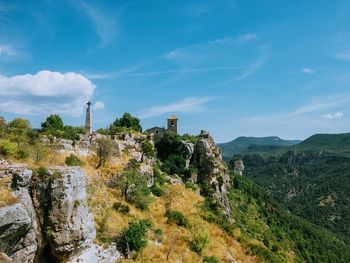 Scenic view of landscape against cloudy sky