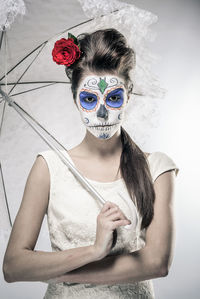 Portrait of young woman wearing mask