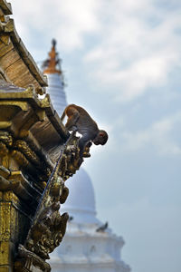 Low angle view of statue against sky