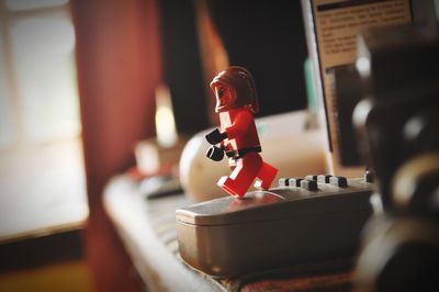 Close-up of person on table at home