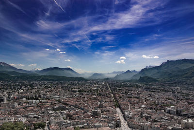 High angle view of cityscape against cloudy sky