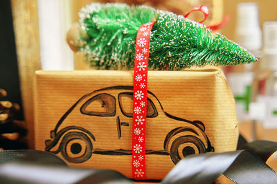 Close-up of christmas decorations on table at home