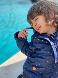 Full length of boy in swimming pool