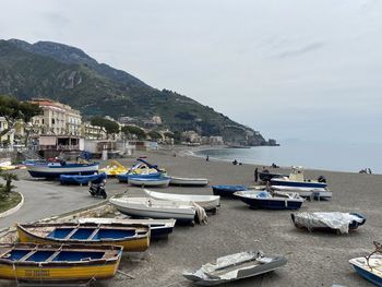 Boats moored at harbor