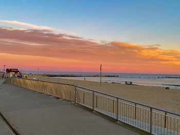 Scenic view of beach against sky during sunset