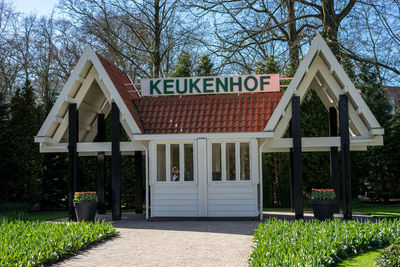 Information sign outside house against building