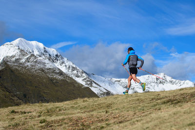 Endurance mountain race. a man with sticks downhill