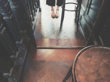 Low section of person standing on staircase