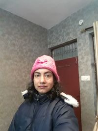 Portrait of woman standing in snow