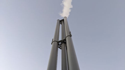 Low angle view of chimney against clear sky