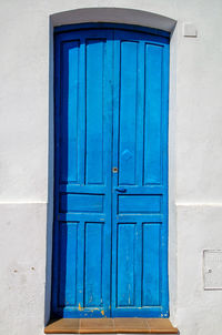 Closed blue door of building