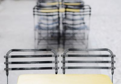 Close-up of chairs and table