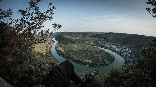 High angle view of man by tree against sky