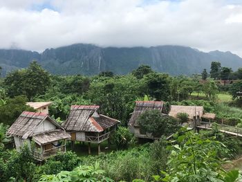 Scenic view of trees and mountains against sky