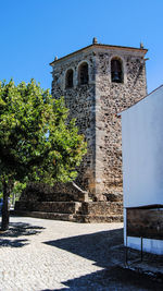 View of historic building against clear blue sky