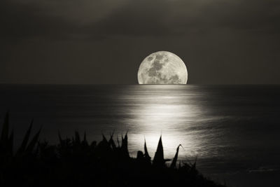 Scenic view of sea against sky at night