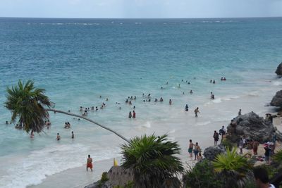 High angle view of people enjoying on beach