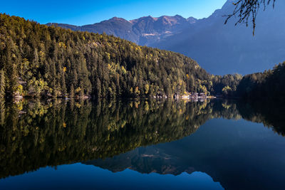 Scenic view of lake and mountains against sky