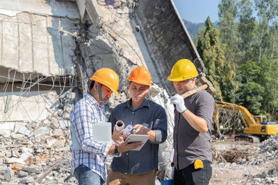 Rear view of man working at construction site