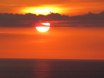 Scenic view of sunset over calm sea