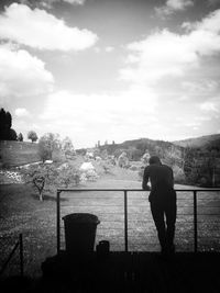 Rear view of man looking at sea