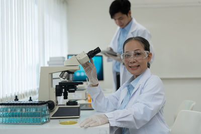 Side view of doctor working at laboratory