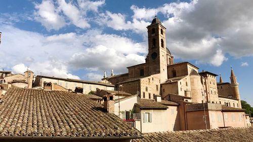 View of town against cloudy sky