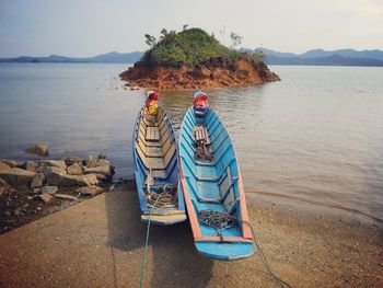 Woman standing by sea