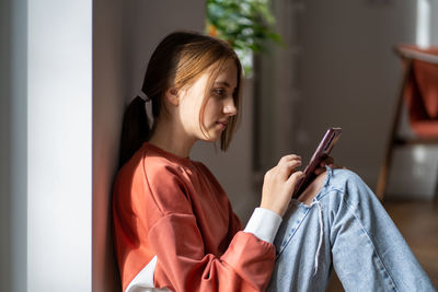 Young woman using mobile phone