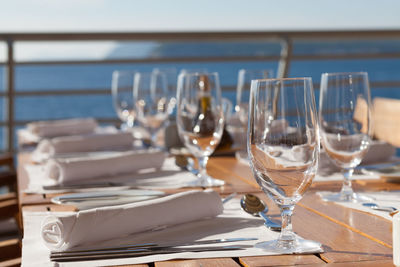 Close-up of place setting by railing