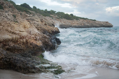 Wave in sea against sky