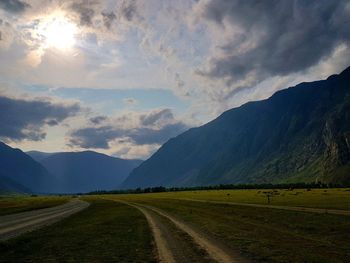 Empty road along countryside landscape